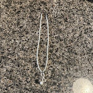 Elegant White Beaded Necklace with Silver infinity